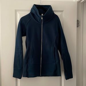 Like new, Lululemon Radiant Jacket in dark teal blue size 8